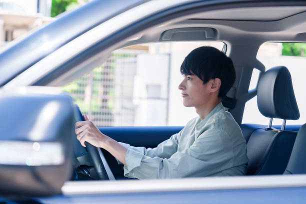 istock Young man enjoying a car drive 2205393662