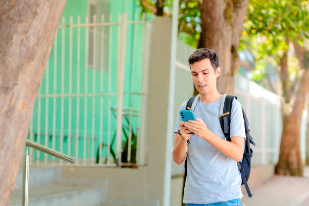 istock Brazilian University Student Using Smartphone Outdoors 2205394297
