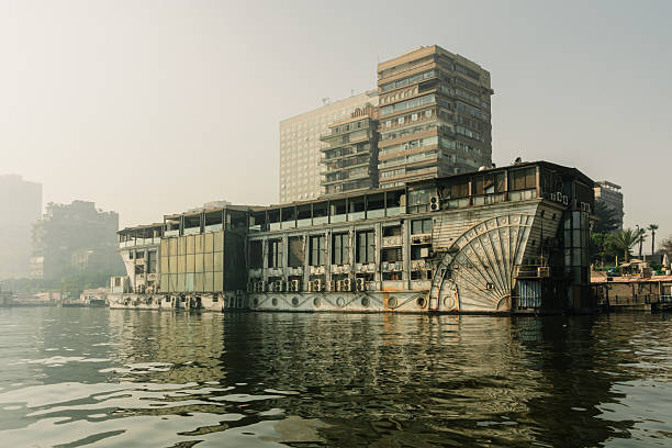 Nile cruise ships in front of the city of Cairo  in hazy smoke