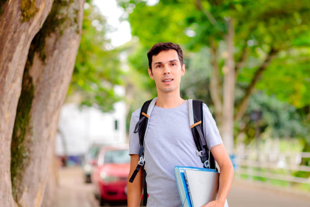 istock Confident Brazilian University Student with Backpack and Laptop 2205395618