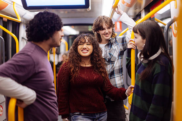 istock Diverse teenagers riding metro train 2205398544