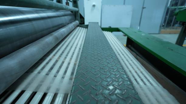 istock Carding machines in a woolen sweater factory 2205398893