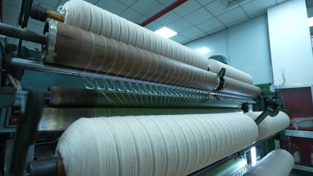 istock Carding machines in a woolen sweater factory 2205398953