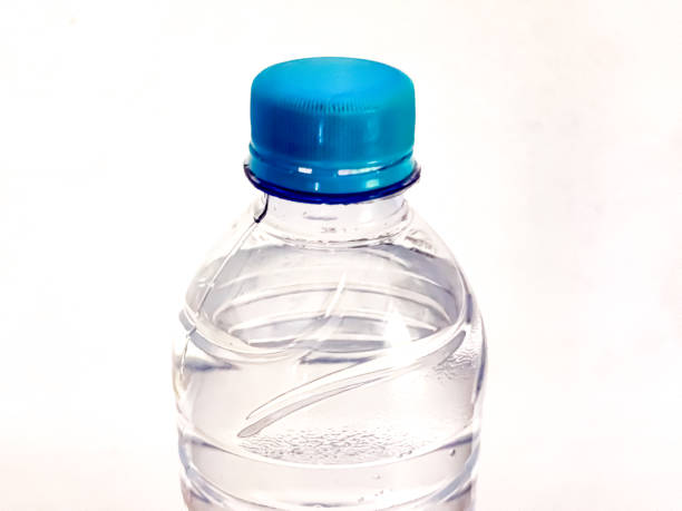 Plastic bottle of still healthy water isolated on white background. Pure drinking water