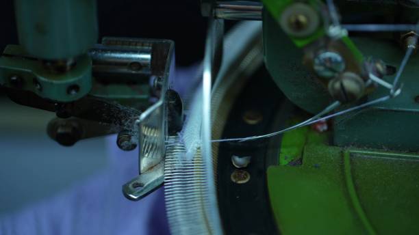 istock Overlock machines in a woolen sweater factory 2205399620