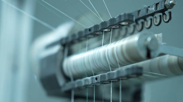 istock Knitting machines in a woolen sweater factory 2205399666