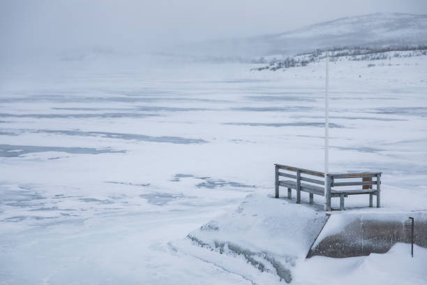 istock Frozen Lake Tornetrask. Cloudy winter day. Abisko, Lapland, Sweden. 2205402851