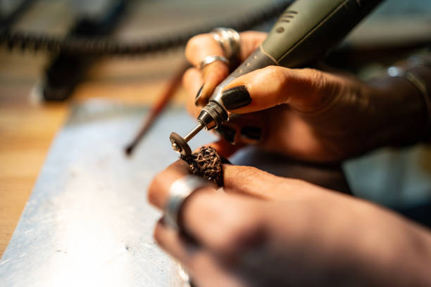 istock Close-Up of Hand Crafting Jewelry Using a Rotary Tool 2205407309
