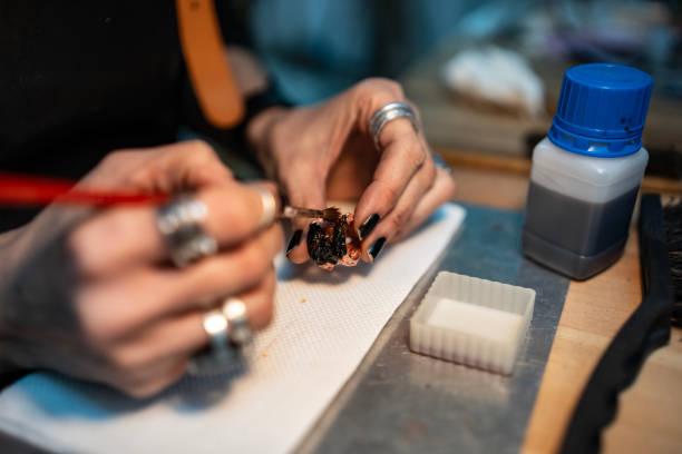 istock Artisan Carefully Working On Decorative Piece in Creative Craft Workshop 2205407341