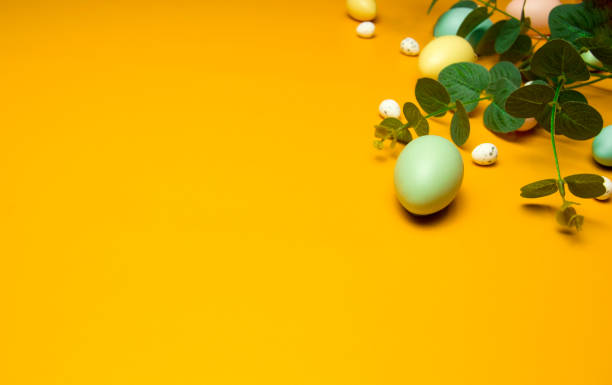 istock Easter eggs on yellow background.Happy Easter concept. Preparation for holiday.Simple minimalism, flat lay, top view, copy space. 2205411229
