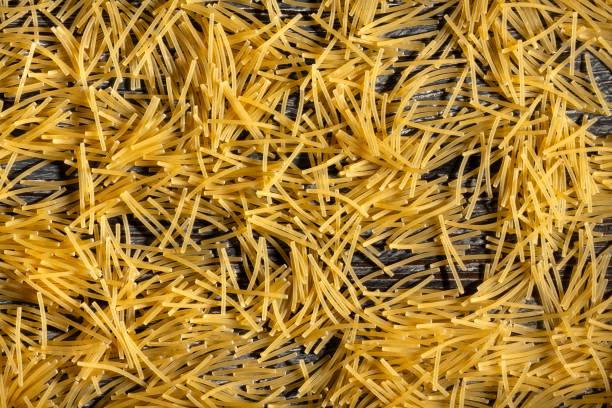 pasta fidelini corti on wood background top view