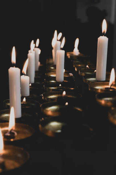 istock Candlelight reflection in a serene setting during evening prayer gathering at a spiritual location 2205417357