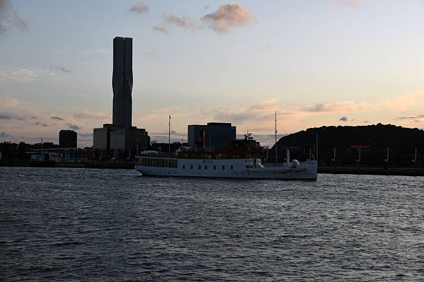 Karlatornet is a skyscraper by Serneke in Lindholmen in Gothenburg, Sweden. The tower has a height of 247 meters and is the tallest building in the Nordic countries. The image was captured during summer season at dusk.