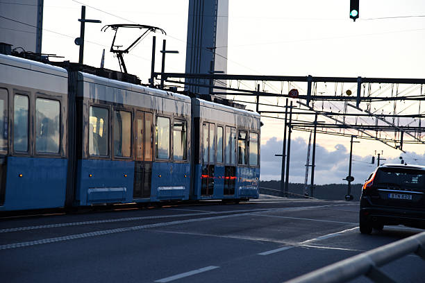 Gothenburg city with a tram at the Hisingsbron bridge. The Gothenburg tram network consists of 12 lines and 132 stations. Captured during summer season.