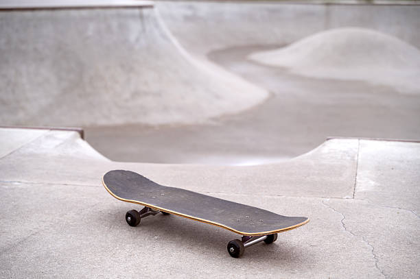 istock A skateboard or a longboard on a pump trek or a pump ramp, copy space 2205429191