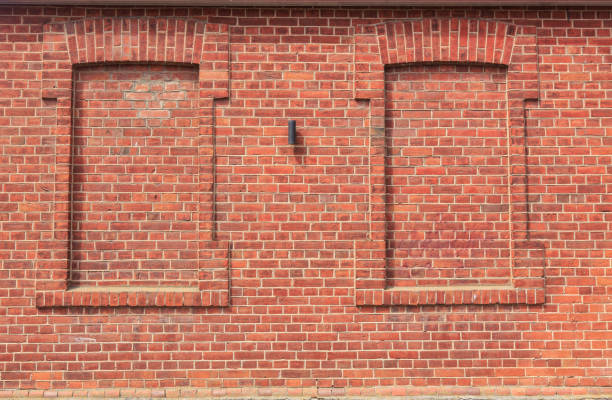 Textured brick wall of old building close-up background