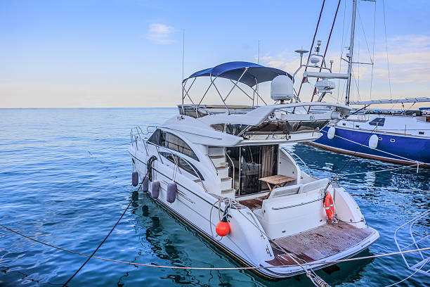 istock Yachts moored at a pier on the seashore 2205431471