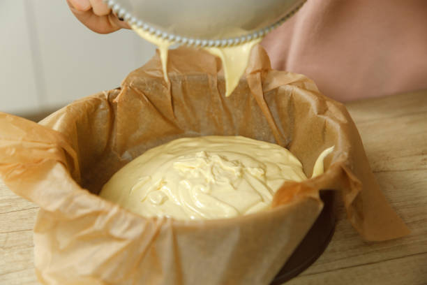 istock Mother and Son are preparing a cherry cake in the kitchen 2205433177
