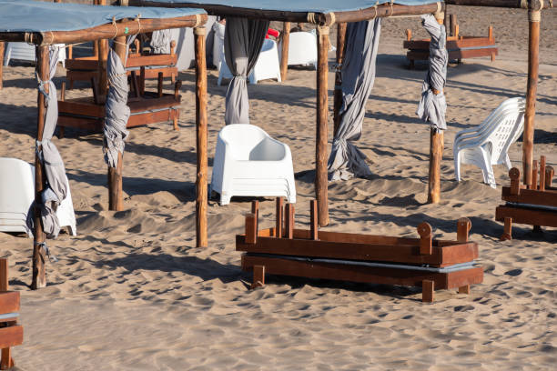 istock Beach stand on the sand with chairs and gazebo. 2205436558