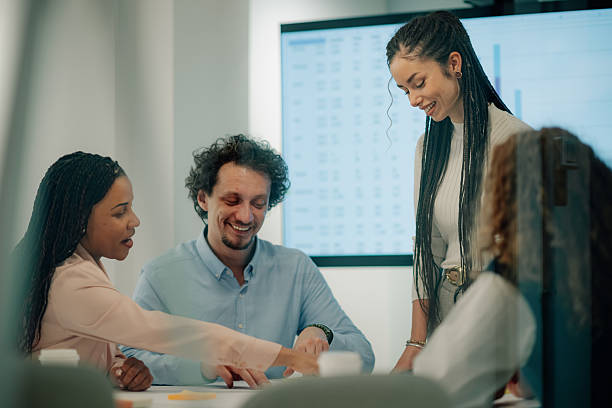 istock Business people collaborating on project in modern office 2205441267