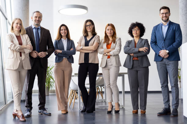 istock Charming Business Team Standing Together in Stylish Office 2205446746