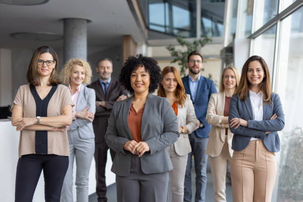 istock Diverse business team posing confidently in modern office 2205446750