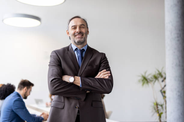 istock Man smiling joyfully in contemporary office environment 2205446779