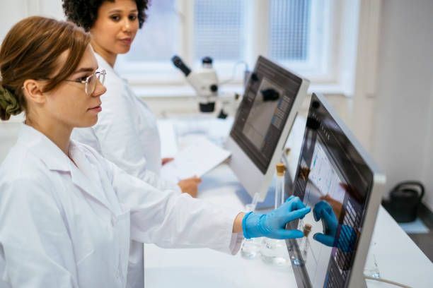 istock Young Female Researchers Analyzing Data in Modern University Laboratory 2205446827