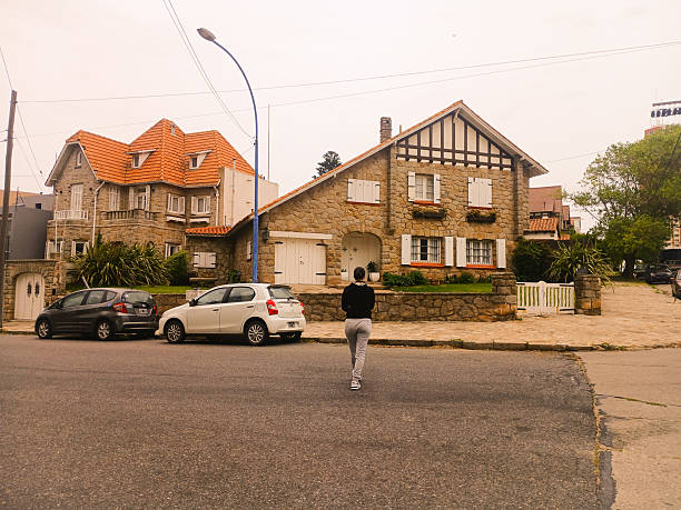Typical architecture  in Mar del Plata,  one person walking  on summer day. February 14th , 2025. Buenos Aires Province, Argentina