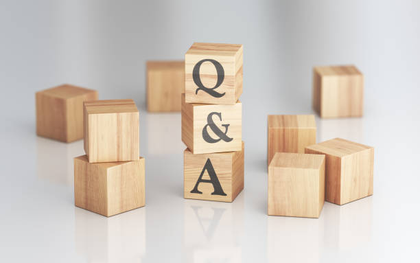 istock Q&A Icon on Wooden Blocks Cube Formation, Depth Of Field 2205447066