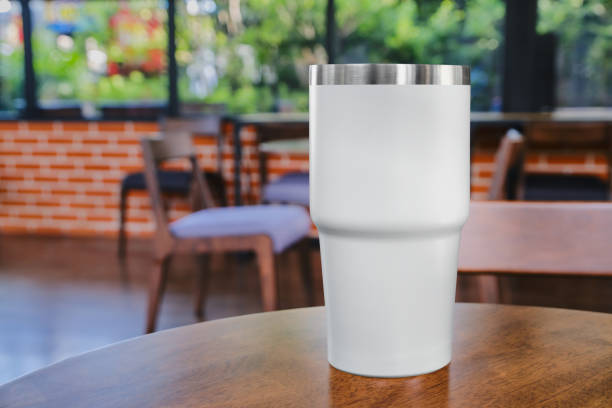 istock Mockup white coffee mug on table in restaurant and cafe 2205447387