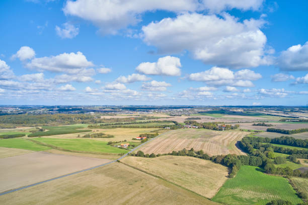 istock A scenic aerial view showcasing peaceful Danish agricultural fields under a blue cloudy sky 2205447585