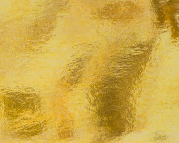 istock Gold foil background metallic golden leaf texture  gradient light shiny wrapping paper bright yellow solid color wallpaper for design decoration element 2205447792