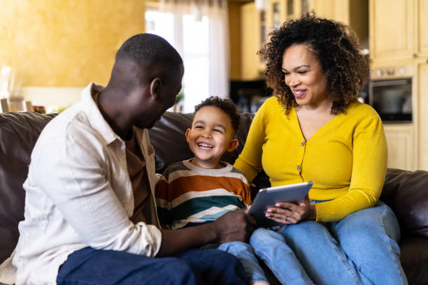 istock Smiling parents spending time with their young son 2205453717