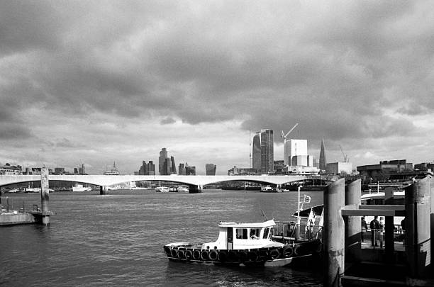 istock Tugboat docking in london with dramatic sky 2205455027