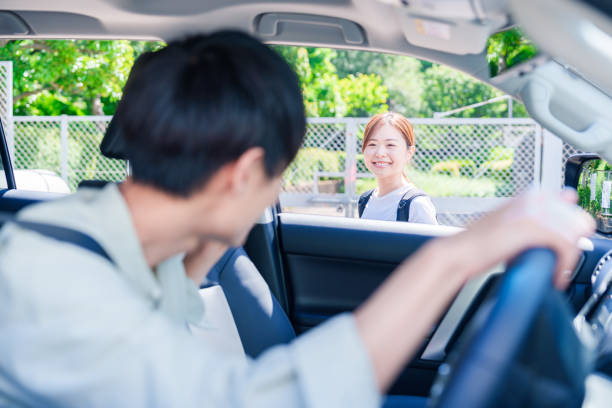istock Young husband driving his wife home 2205455318