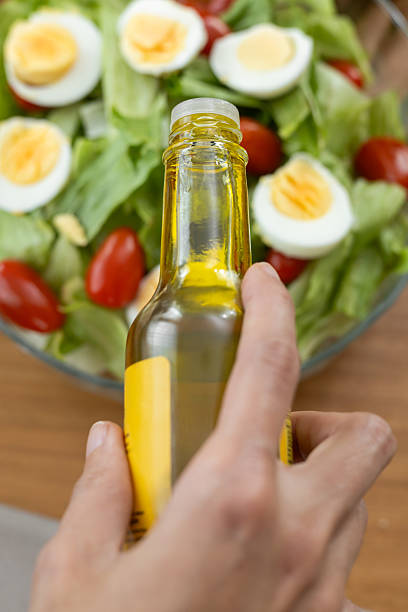 istock Olive Oil Drizzle on Healthy Post-Gym Salad 2205459275