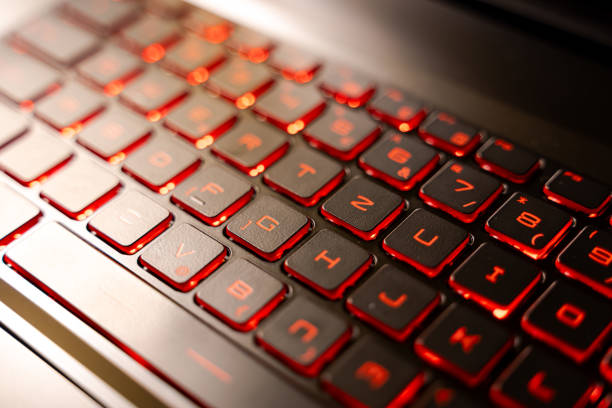 istock Illuminated Red Gaming Laptop Keyboard Close-Up 2205459566