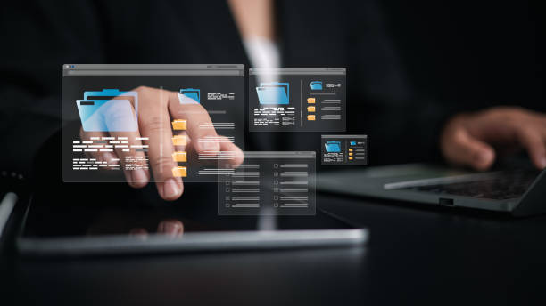 istock Document Management System (DMS) being setup by IT consultant working on laptop computer in office, Businesswoman using computer to document management, Workflow sharing, Backup online document files 2205463030