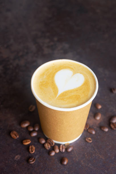 istock hot latte coffee in takeaway paper coffee cup. 2205463601