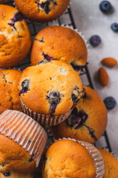 istock Blueberry muffins on the grill, next to blueberries 2205463927