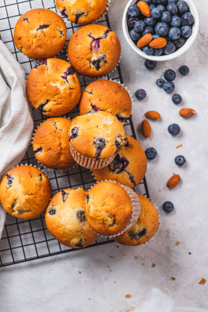 istock Blueberry muffins on the grill, next to blueberries 2205463939