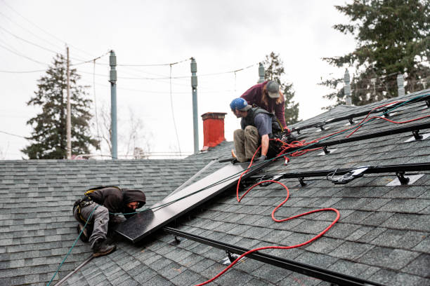 istock Electrician Wiring Up Solar Panel System on Home 2205465597