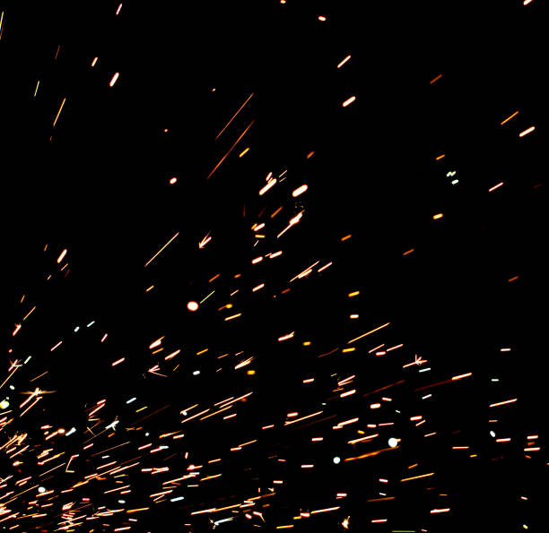 istock A black background with a lot of sparks and fire 2205467649