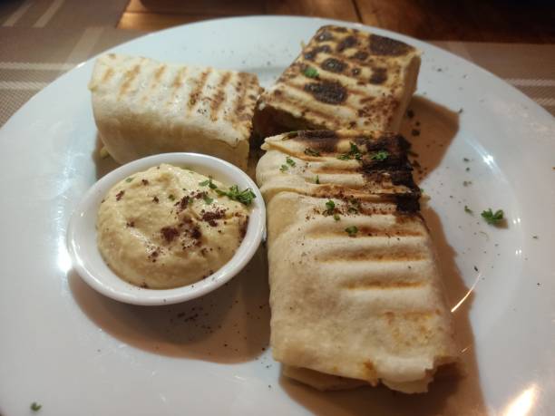 istock shawarma wraps with falafel filling along with hummus dip 2205468452
