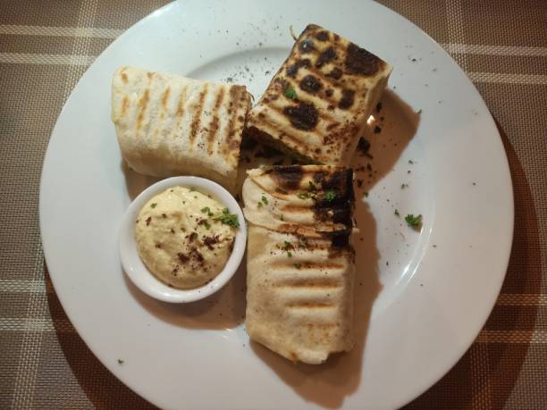istock shawarma wraps with falafel filling along with hummus dip 2205468453