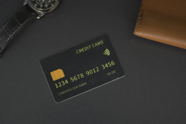 istock Black credit card on white background. 2205473303