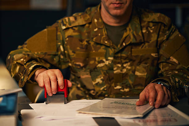 istock Military Officer Stamping Important Documents 2205474982
