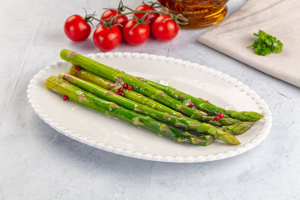 Vegan cuisine cooked asparagus stems with olive oil