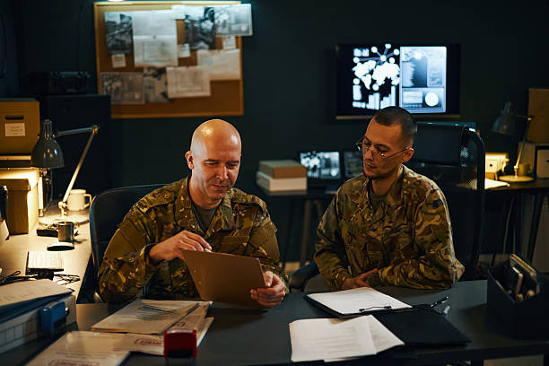 istock Discussing Strategic Military Plans in Command Center 2205475387